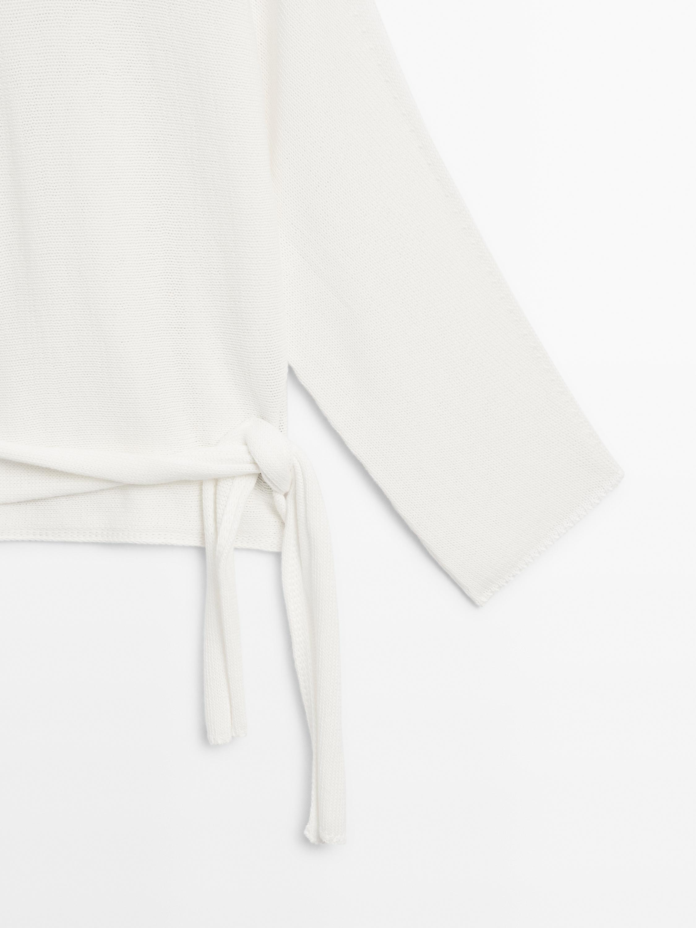 Knit sweater with bow detail